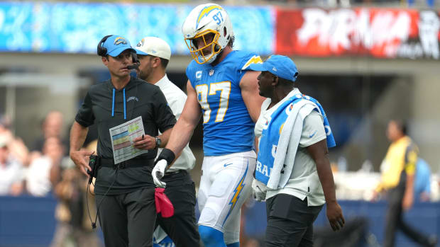 Los Angeles Chargers linebacker Joey Bosa (97) walks off the field with Brandon Staley after suffering an injury against the Jacksonville Jaguars in the first half at SoFi Stadium.