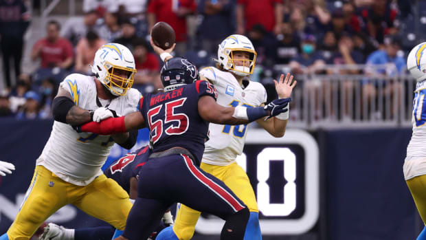 Dec 26, 2021; Houston, Texas, USA; Los Angeles Chargers quarterback Justin Herbert (10) attempts a pass during the third quarter against the Houston Texans at NRG Stadium. Mandatory Credit: Troy Taormina-USA TODAY Sports