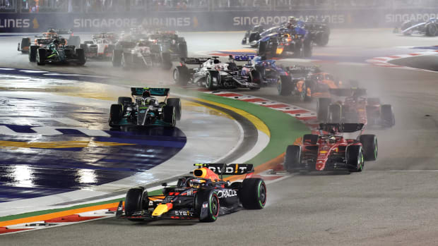 Red Bull driver Sergio Perez of Mexico leads the field soon after the start of the Singapore Formula One Grand Prix, at the Marina Bay City Circuit in Singapore.
