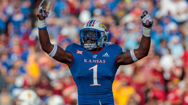 Oct 1, 2022; Lawrence, Kansas, USA; Kansas Jayhawks safety Kenny Logan Jr. (1) celebrates after a play during the third quarter against the Iowa State Cyclones at David Booth Kansas Memorial Stadium. Mandatory Credit: William Purnell-USA TODAY Sports