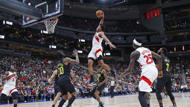 Toronto Raptors forward Scottie Barnes (4) dunks the ball over top of Utah Jazz guard Jordan Clarkson (00) during the first quarter at Rogers Place