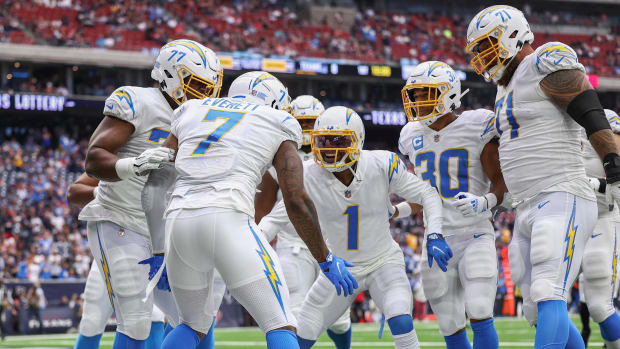 Los Angeles Chargers tight end Gerald Everett (7) celebrates with teammates after making a touchdown reception during the first quarter against the Houston Texans at NRG Stadium.