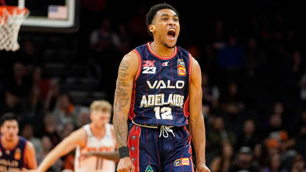 Adelaide 36ers’ Craig Randall II (12) celebrates back to back three- pointers against the Suns.