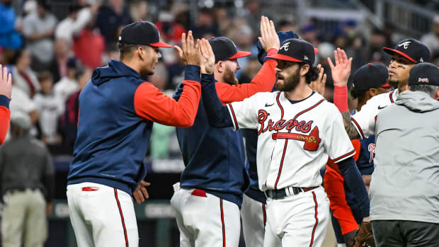 Dansby Swanson and the Braves celebrate after beating the Mets