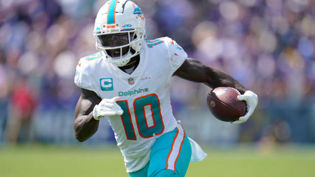 Miami Dolphins wide receiver Tyreek Hill (10) runs a play during the first half of an NFL football game against the Baltimore Ravens, Sunday, Sept. 18, 2022, in Baltimore. (AP Photo/Julio Cortez)