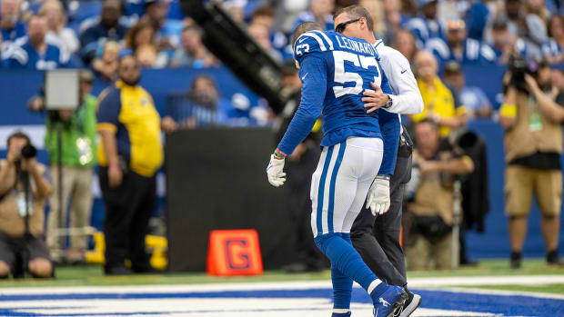 Colts linebacker Shaquille Leonard (53) is walked off the field with an injury during the second quarter against the Titans.