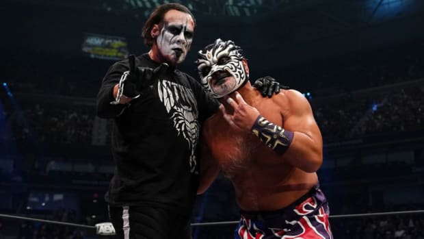 Sting and The Great Muta pose in the ring during an AEW show