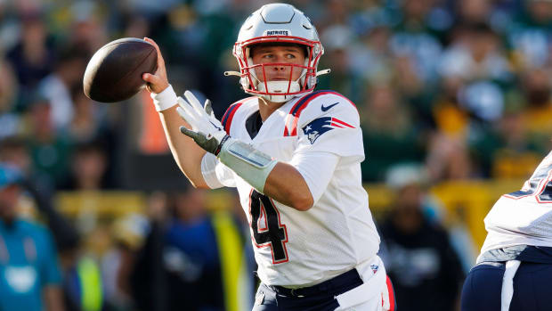 Patriots quarterback Bailey Zappe (4) throws a pass during the second quarter against the Green Bay Packers.