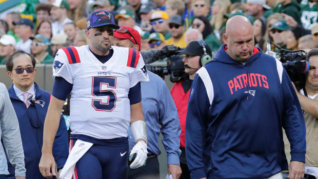Patriots quarterback Brian Hoyer (5) leaves the field in the second quarter against the Packers at Lambeau Field.