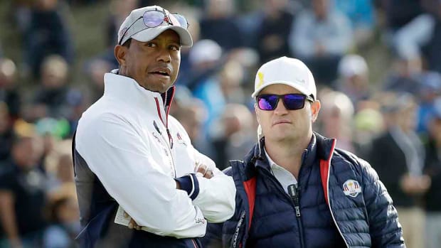 Tiger Woods and Zach Johnson are pictured at the 2018 Ryder Cup at Le Golf National in Paris.