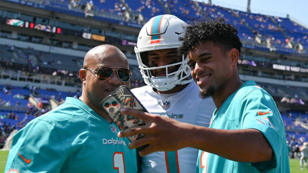 Maryland Terrapins quarterback Taulia Tagovailoa takes a selfie with Miami Dolphins quarterback Tua Tagovailoa (1) and their father Galu.