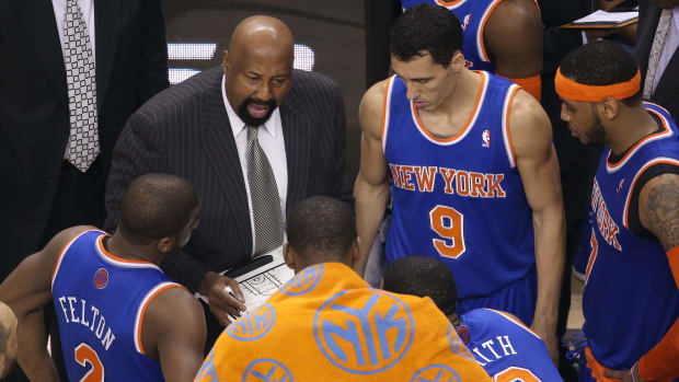 Apr 11, 2014; Toronto, Ontario, CAN; New York Knicks head coach Mike Woodson talks to his players during a timeout against the Toronto Raptors at Air Canada Centre. The Knicks beat the Raptors 108-100. Mandatory Credit: Tom Szczerbowski-USA TODAY Sports