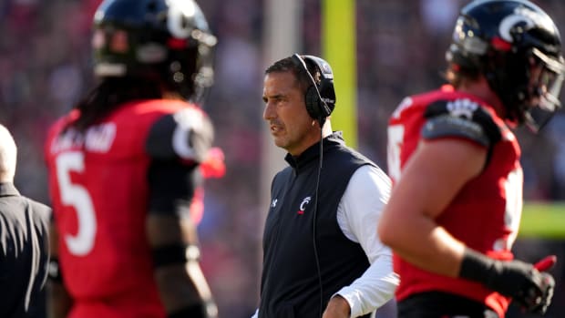 Cincinnati Bearcats head coach Luke Fickell observes as the defense comes off the field in the second quarter of a college football game against the Indiana Hoosiers, Saturday, Sept. 24, 2022, at Nippert Stadium in Cincinnati. Ncaaf Indiana Hoosiers At Cincinnati Bearcats Sept 24 0246