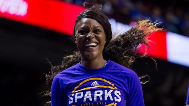 Sparks forward Tiffany Jackson smiles while warming up for a WNBA Finals game against the Lynx.