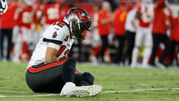 Buccaneers quarterback Tom Brady (12) on the ground after he was sacked and fumbled the ball against the Chiefs.