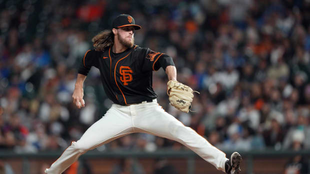 SF Giants pitcher Cole Waites throws a pitch.
