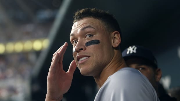 New York Yankees Aaron Judge looks from dugout after hitting 62nd home run
