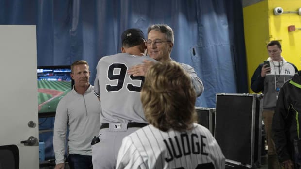 Roger Maris Jr. hugs New York Yankees OF Aaron Judge