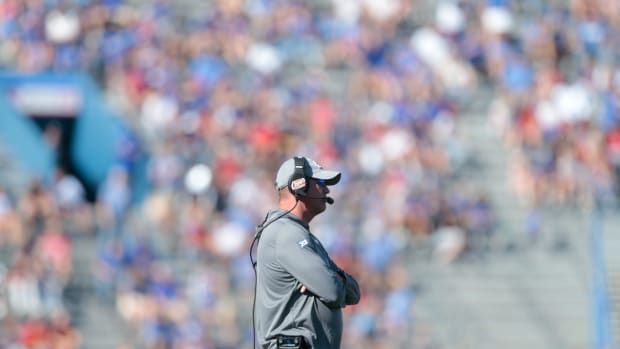 Kansas coach Lance Leipold waits on the field while a play is reviewed during the second quarter of Saturday's game against Iowa State inside David Booth Kansas Memorial Stadium.