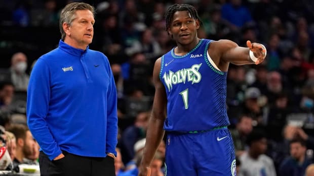 Apr 10, 2022; Minneapolis, Minnesota, USA; Minnesota Timberwolves head coach Chris Finch and guard Anthony Edwards (1) discus the previous play against the Chicago Bulls during the second quarter at Target Center.
