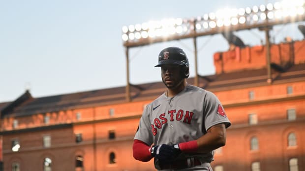 Red Sox left fielder Tommy Pham (22) returns to the dugout during the first inning against the Orioles.