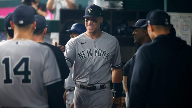 Yankees right fielder Aaron Judge (99) walks in the dugout after being taken out in the second inning against the Rangers at Globe Life Field.