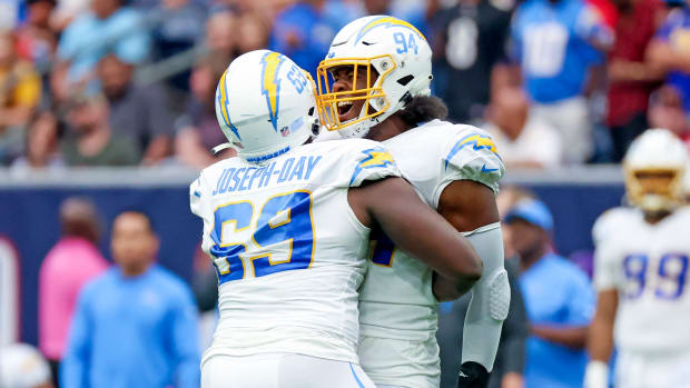 Oct 2, 2022; Houston, Texas, USA; Los Angeles Chargers defensive tackle Sebastian Joseph-Day (69) celebrates with Los Angeles Chargers linebacker Chris Rumph II (94) during the fourth quarter against the Houston Texans at NRG Stadium. Mandatory Credit: Kevin Jairaj-USA TODAY Sports