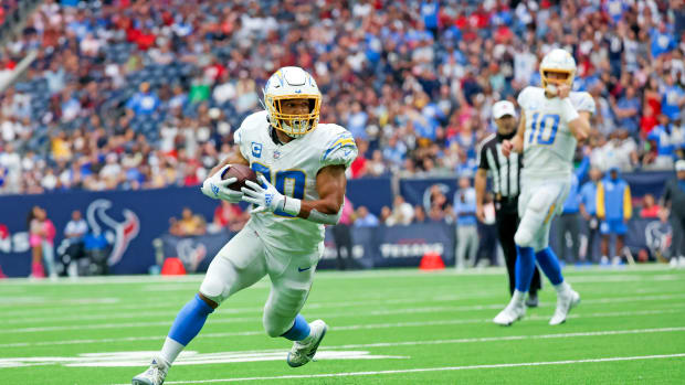 Oct 2, 2022; Houston, Texas, USA; Los Angeles Chargers running back Austin Ekeler (30) runs for a touchdown during the fourth quarter against the Houston Texans at NRG Stadium. Mandatory Credit: Kevin Jairaj-USA TODAY Sports