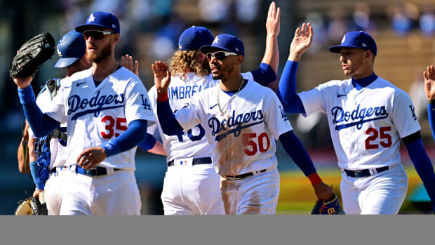 Aug 21, 2022; Los Angeles, California, USA;  Los Angeles Dodgers center fielder Cody Bellinger (35), right fielder Mookie Betts (50) and left fielder Trayce Thompson (25)  celebrate the victory against the Miami Marlins at Dodger Stadium.