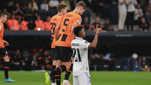 Rodrygo pictured on his knees celebrating after scoring for Real Madrid against Shakhtar Donetsk in October 2022