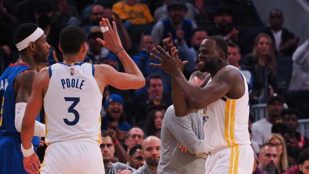 Jordan Poole and Draymond Green celebrate for the Warriors.
