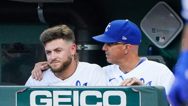 Jul 12, 2022; Kansas City, Missouri, USA; Kansas City Royals bench coach Pedro Grifol (right) talks with center fielder Kyle Isbel (left) in the dugout during the second inning against the Detroit Tigers at Kauffman Stadium. Mandatory Credit: Denny Medley-USA TODAY Sports