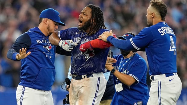 Sep 26, 2022; Toronto, Ontario, CAN; Toronto Blue Jays first baseman Vladimir Guerrero Jr. (center) celebrates after hitting a walk-off single against the New York Yankees during the tenth inning at Rogers Centre.