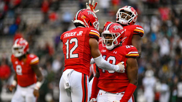 Oct 1, 2022; College Park, Maryland, USA; Maryland Terrapins defensive lineman Taizse Johnson (40) celebrates with defensive back Dante Trader Jr. (12) during the second half against the Michigan State Spartans at Capital One Field at Maryland Stadium. Mandatory Credit: Tommy Gilligan-USA TODAY Sports