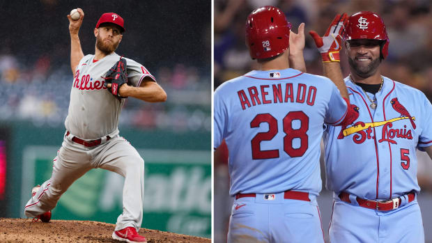Phillies pitcher Zack Wheeler side-by-side with Cardinals players Nolan Arenado and Albert Pujols