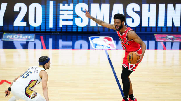 Chicago Bulls guard Coby White (0) points down the court against New Orleans Pelicans