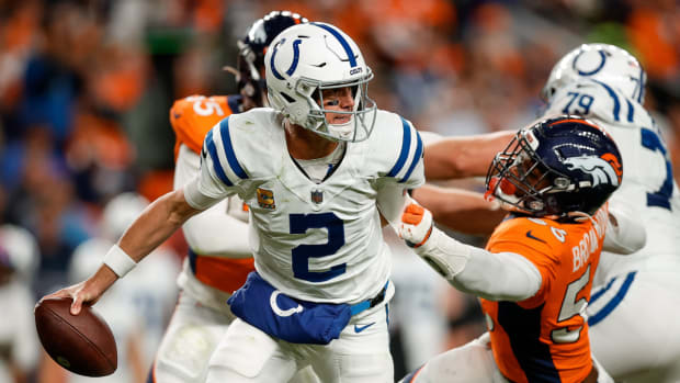 Colts quarterback Matt Ryan tries to throw the ball while under pressure from Denver Broncos cornerback Pat Surtain II and linebacker Baron Browning on Oct. 6, 2022.