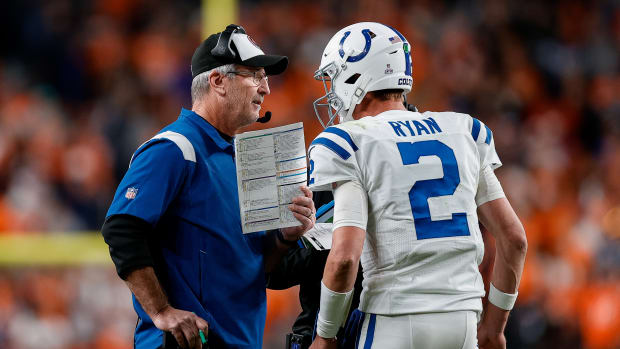 Oct 6, 2022; Denver, Colorado, USA; Indianapolis Colts head coach Frank Reich talks with quarterback Matt Ryan (2) in the fourth quarter against the Denver Broncos at Empower Field at Mile High.
