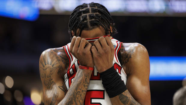 Chicago Bulls forward Derrick Jones Jr. (5) wipes his face inside his jersey