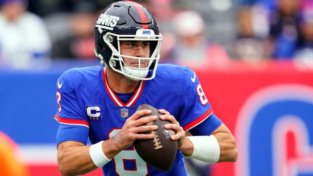 Giants quarterback Daniel Jones rolls out to pass in a game vs. the Chicago Bears.