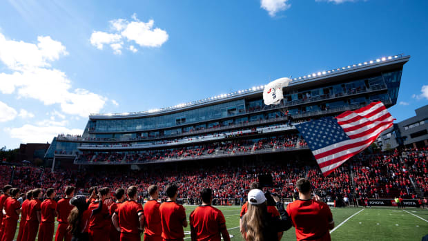A skydiver drops into the stadium during the National Anthem before the NCAA Football game at Nippert Stadium in Cincinnati on Saturday, Oct. 8, 2022. Cincinnati Bearcats defeated South Florida Bulls 28-24. South Florida Bulls At Cincinnati Bearcats 575