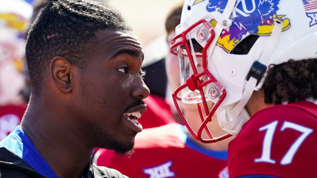 Oct 8, 2022; Lawrence, Kansas, USA; Kansas Jayhawks quarterback Jalon Daniels (6) talks with quarterback Jason Bean (17) after leaving the game with an injury during the second half against the TCU Horned Frogs at David Booth Kansas Memorial Stadium. Mandatory Credit: Jay Biggerstaff-USA TODAY Sports