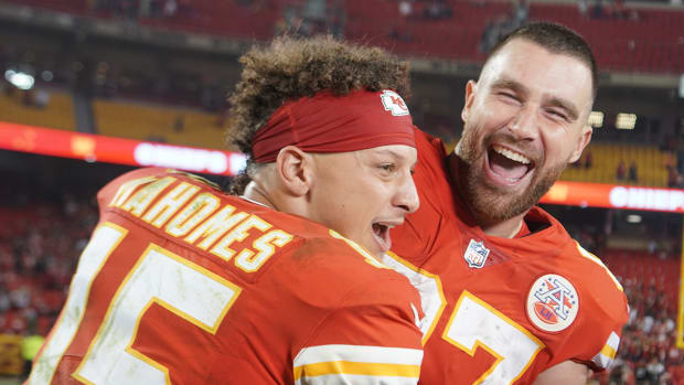 Oct 10, 2022; Kansas City, Missouri, USA; Kansas City Chiefs quarterback Patrick Mahomes (15) interrupts tight end Travis Kelce (87) while talking with a report after the game against the Las Vegas Raiders at GEHA Field at Arrowhead Stadium.