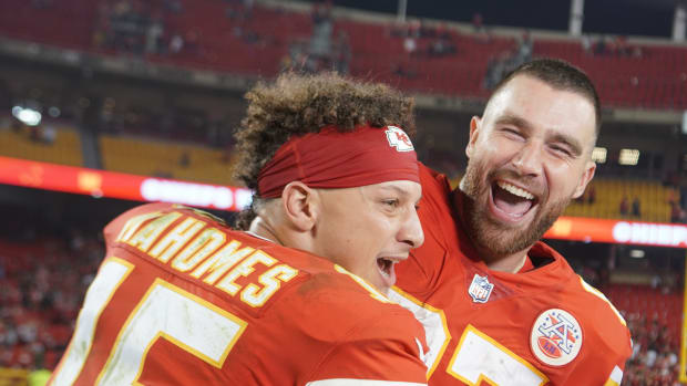 Oct 10, 2022; Kansas City, Missouri, USA; Kansas City Chiefs quarterback Patrick Mahomes (15) interrupts tight end Travis Kelce (87) while talking with a report after the game against the Las Vegas Raiders at GEHA Field at Arrowhead Stadium. Mandatory Credit: Denny Medley-USA TODAY Sports