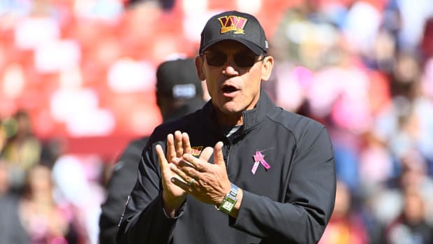 Washington Commanders head coach Ron Rivera on the field before the game against the Tennessee Titans at FedExField.