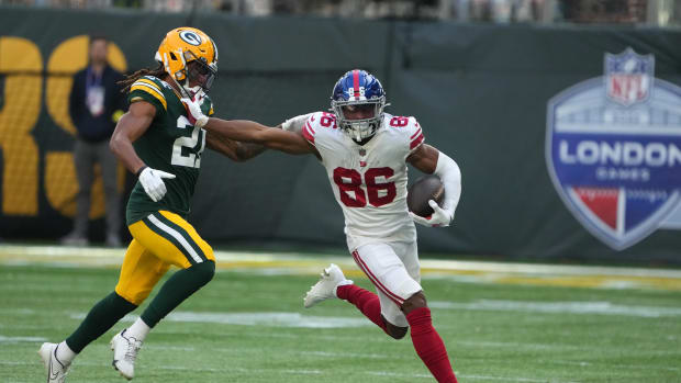 Oct 9, 2022; London, United Kingdom; New York Giants wide receiver Darius Slayton (86) carries the ball as Green Bay Packers cornerback Eric Stokes (21) defends during an NFL International Series game at Tottenham Hotspur Stadium.