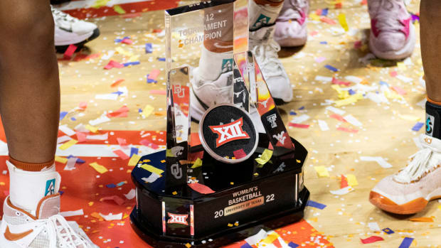 Mar 13, 2022; Kansas City, MO, USA; The Big 12 Women s Basketball Tournament trophy is awarded to the Texas Longhorns after defeating the Baylor Lady Bears at Municipal Auditorium. Mandatory Credit: Amy Kontras-USA TODAY Sports
