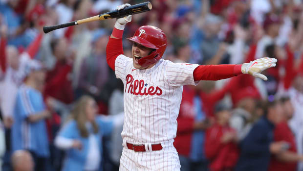 Phillies first baseman Rhys Hoskins celebrates after hitting a three-run home run.
