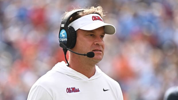 Oct 15, 2022; Oxford, Mississippi, USA; Mississippi Rebels head coach Lane Kiffin walks off the field during a timeout during the first quarter of the game against the Auburn Tigers at Vaught-Hemingway Stadium. Mandatory Credit: Matt Bush-USA TODAY Sports