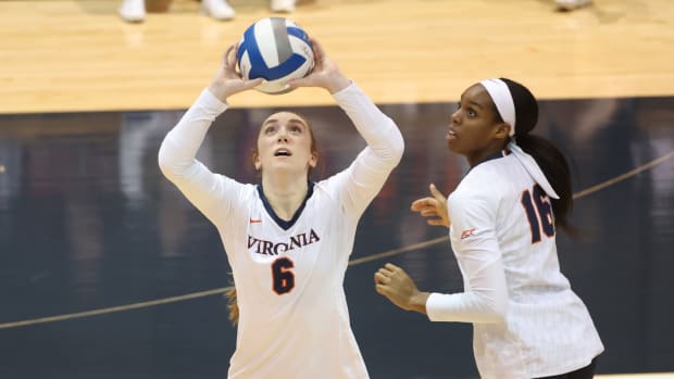 Gabby Easton sets the ball for Veresia Yon during the Virginia volleyball game against Florida State at Memorial Gymnasium.